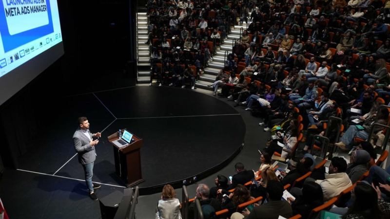 Lebanon tech conference — speaker presenting to a packed auditorium